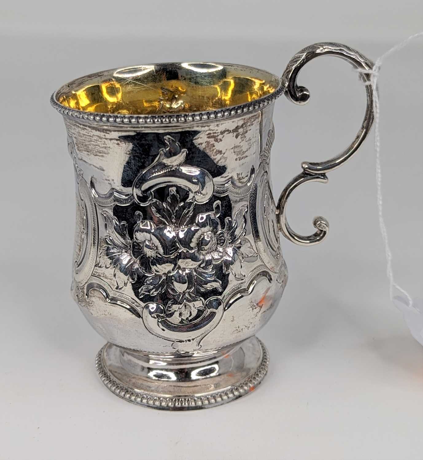 A Victorian silver christening tankard, of bell shape, having floral repousse decoration, - Image 2 of 5