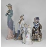 A collection of four Lladro and Casades porcelain figures, largest height 37cm