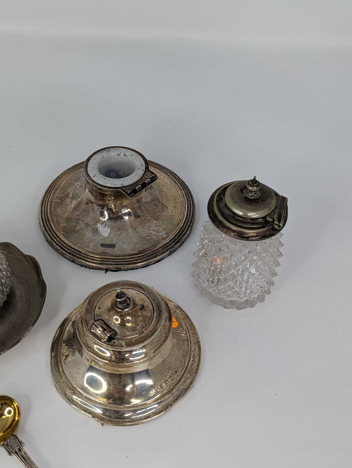 A George V silver capstan inkwell of shaped oval form on a weighted base together with various other - Image 3 of 4