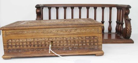 An Indian carved hardwood box, having a fitted interior, width 31cm, together with a carved hardwood