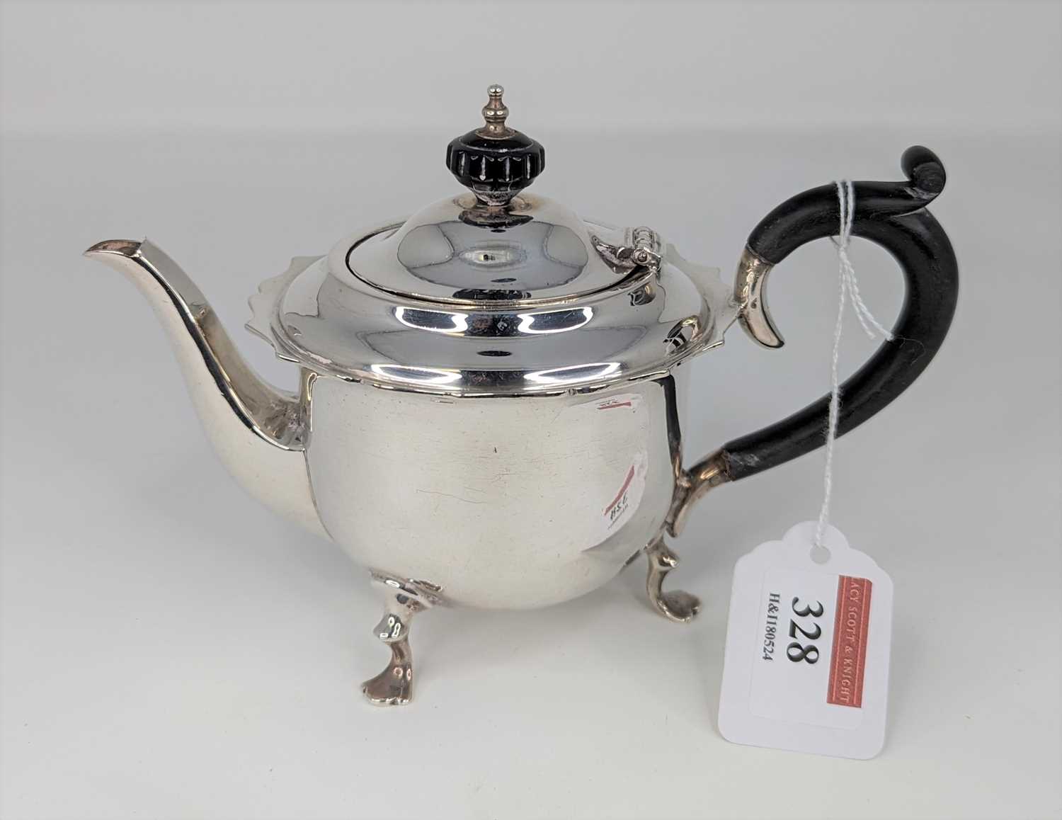 A George V silver bachelor's teapot, having ebonised finial and handle, on pad feet, maker James - Image 2 of 3