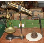 A 19th century cast iron and brass balance scale, height 57cm, together with a graduated set of
