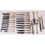 A collection of silver and silver handled flatware, to include a set of 22 pistol-grip knives