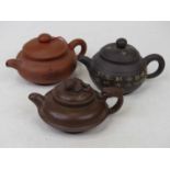 Three Chinese Yixing type teapots, the largest height 8.5cm