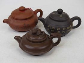 Three Chinese Yixing type teapots, the largest height 8.5cm