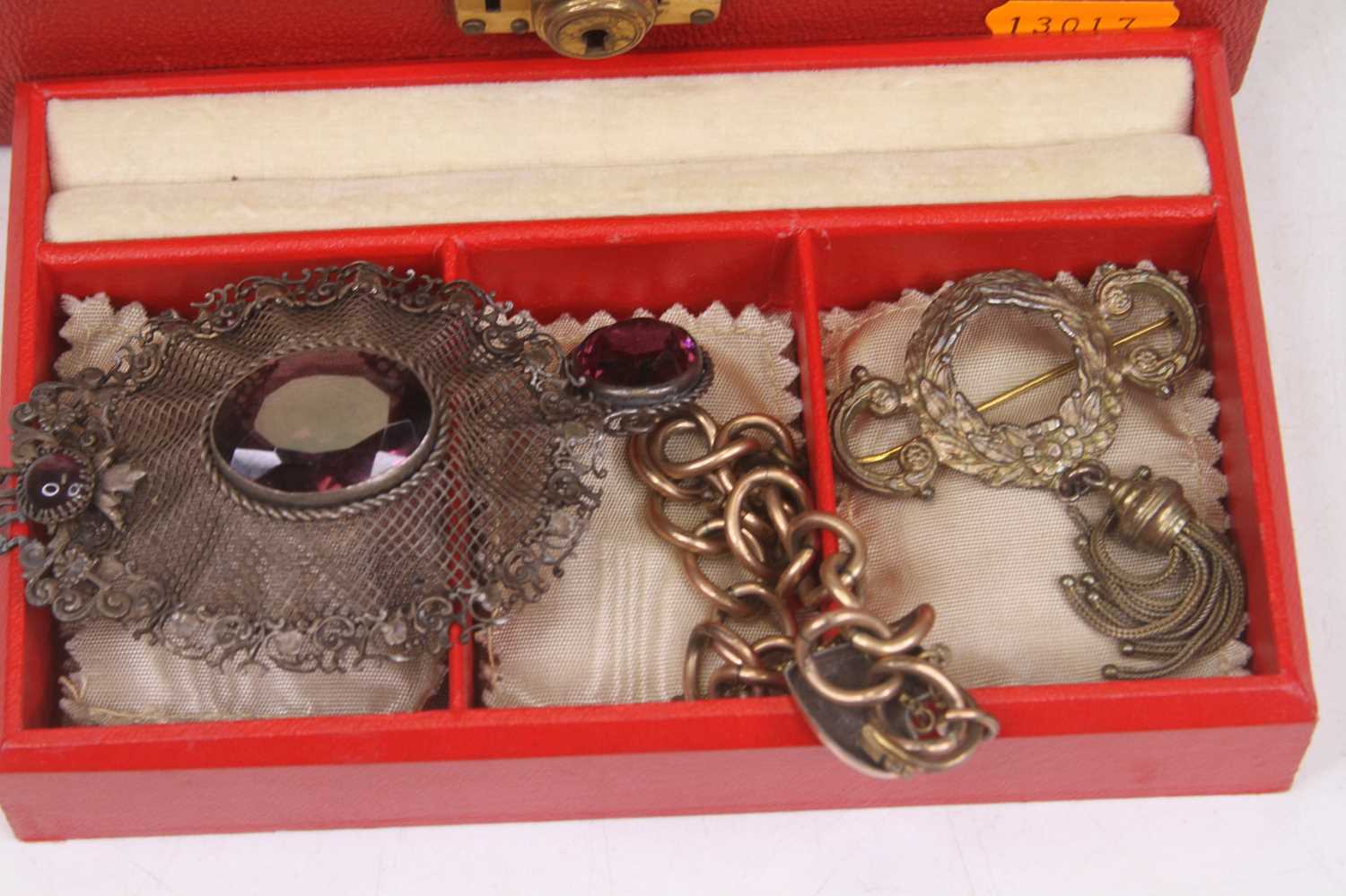 A vintage jewellery box containing a small quantity of costume jewellery