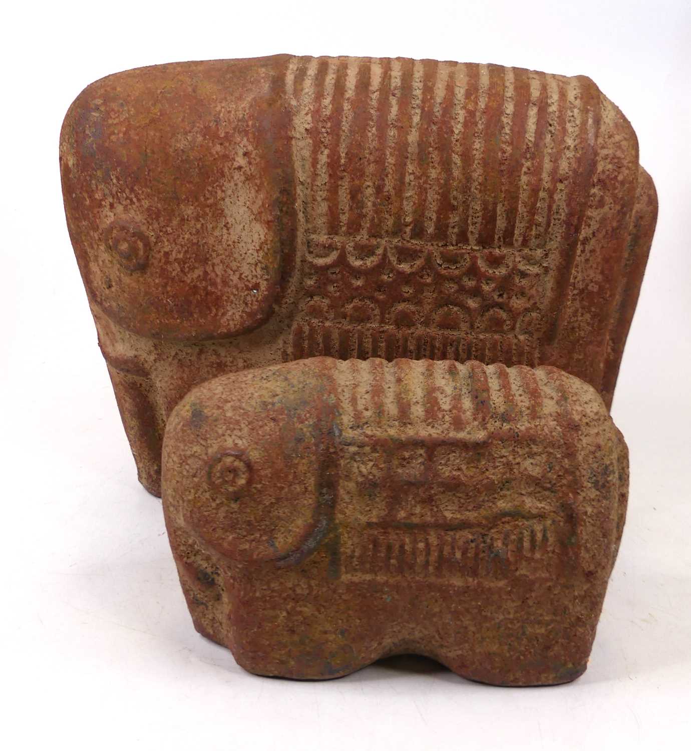 A South American earthenware model of a stylised elephant, height 28cm, together with another