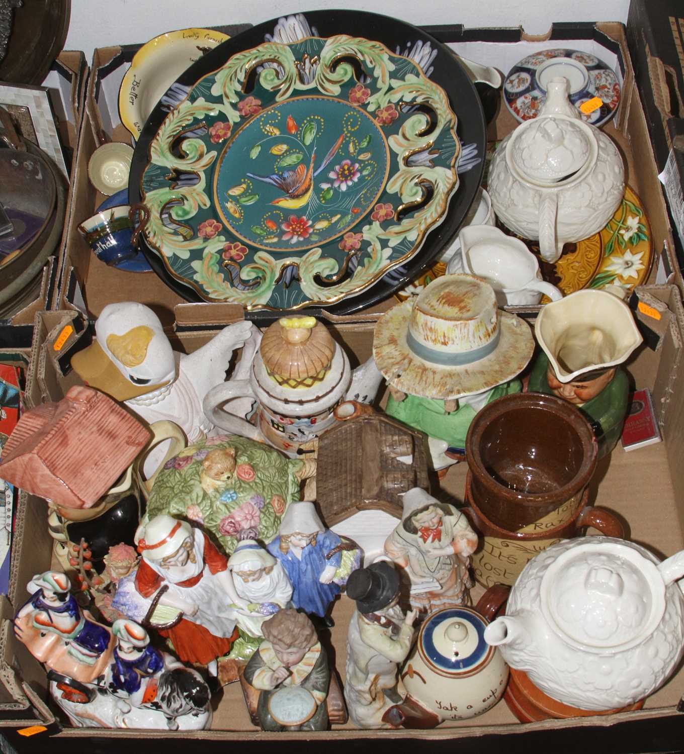 Two boxes of ceramics to include Cornish mottoware, novelty teapot and Staffordshire figures