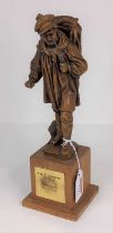 A carved wood figure of a man, titled Captain E. Champion PC&A - FSD 1965-1968, h.28cm Broken and