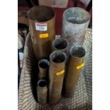 A collection of seven brass shell cases