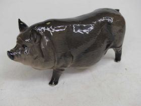 A Royal Doulton pottery model of a pot bellied pig, length 16cm