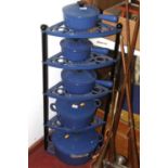 A graduated set of five Le Creuset blue cast iron saucepans, larges dia. 30cm, on a Le Creuset
