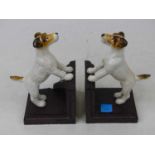 A pair of novelty painted cast iron bookends, each in the form of a jack russell, height 15cm