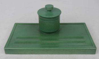 Keith Murray for Wedgwood, a matt green glazed pottery inkwell, the ribbed cylindrical inkwell above
