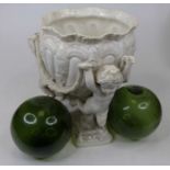 A Spode white glazed pottery jardiniere upon three figural putti supports, height 26cm, and two