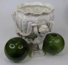 A Spode white glazed pottery jardiniere upon three figural putti supports, height 26cm, and two