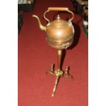 An Indian copper kettle on stand, having engraved foliate decoration, height 71cm
