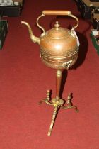 An Indian copper kettle on stand, having engraved foliate decoration, height 71cm