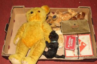 A vintage golden mohair teddy bear having opposable limbs and glass eyes, height 45cm, together with