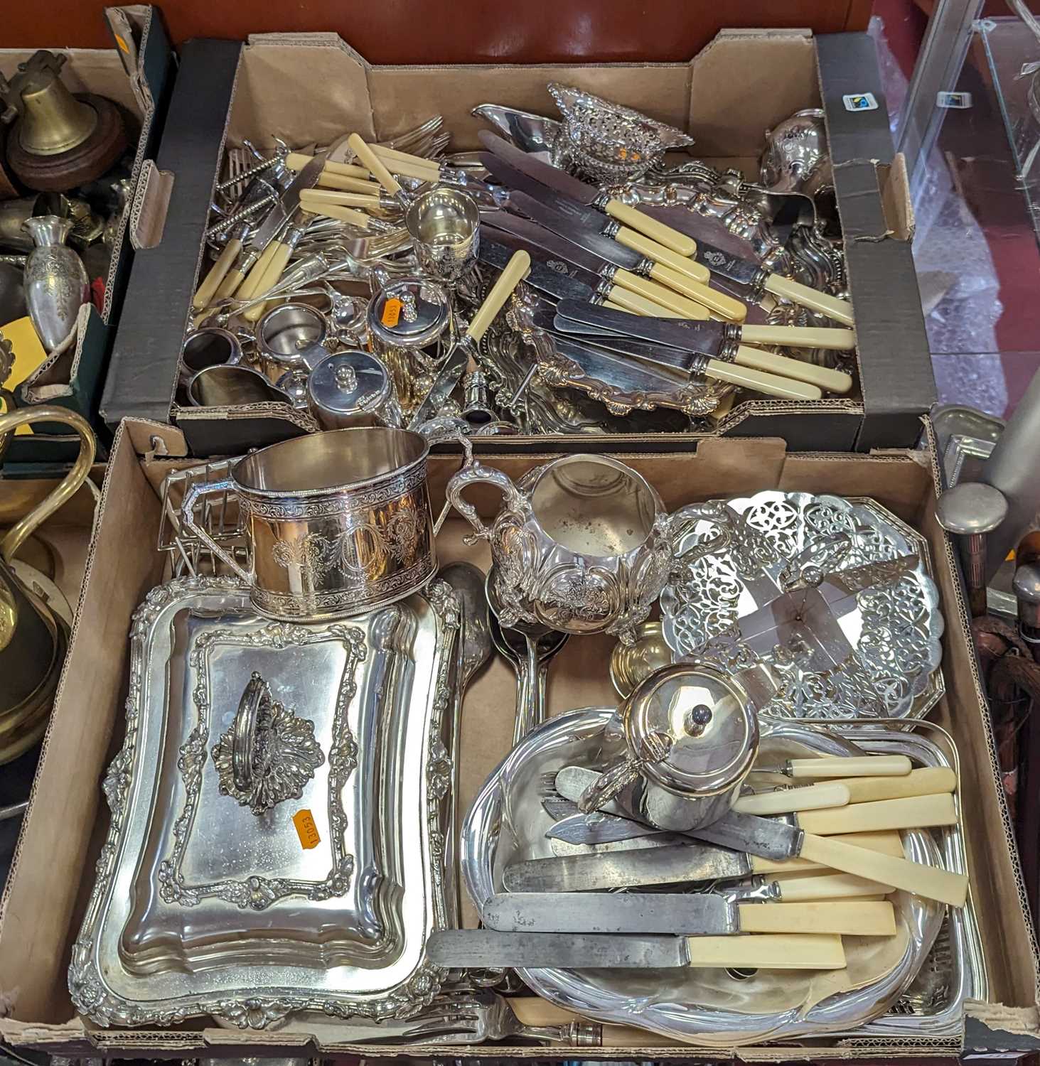 A collection of silver plated items to include a rectangular entree dish, twin handled sugar bowl,