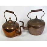 A near pair of Victorian copper range kettles, each height 32cm