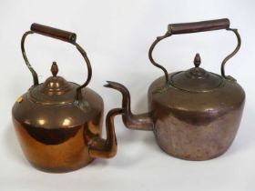 A near pair of Victorian copper range kettles, each height 32cm