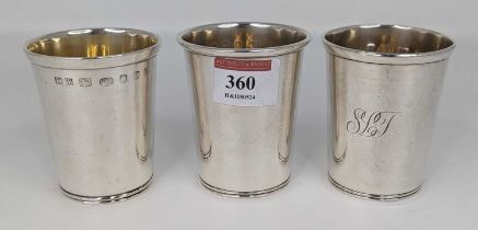 A set of three modern silver beakers each of plain cylindrical form having gilt washed interiors,