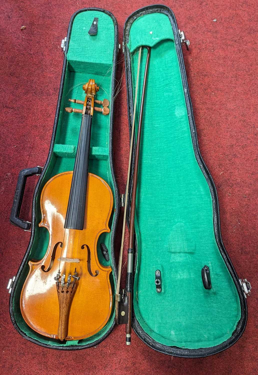A Stentor quarter size student's violin, cased with bow