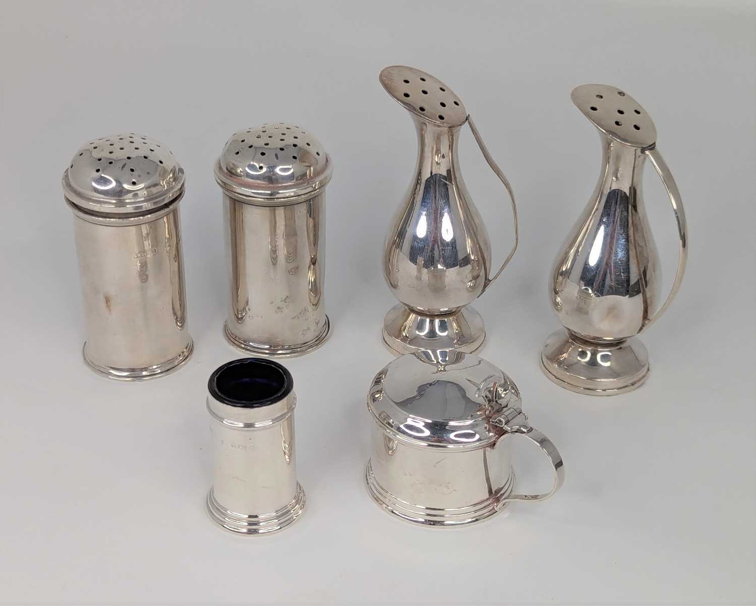 A pair of continental white metal pepperettes, each in the form of a jug, stamped verso Silver