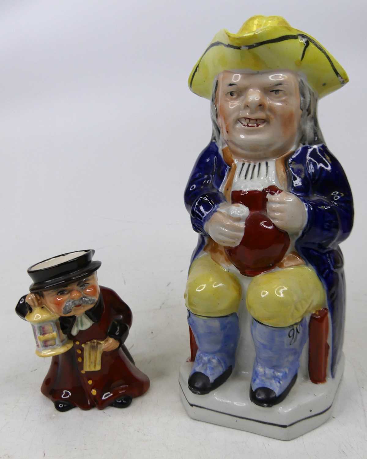 A Victorian Staffordshire pottery toby jug, height 25cm, together with a Wedgwood character jug,