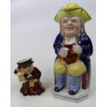 A Victorian Staffordshire pottery toby jug, height 25cm, together with a Wedgwood character jug,