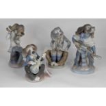 A Lladro porcelain four-piece dog band, largest height 22cm All appear to be intact.