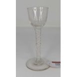 An 18th century cordial/liqueur glass, having a bell shaped bowl, on opaque airtwist stem and