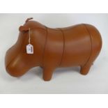 A leather clad footstool, in the form of a hippo, length 52cm Condition is good overall, no tears or