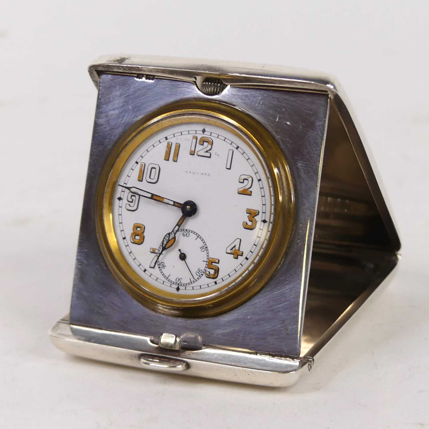 A George V silver cased travel clock, having a circular enamelled dial with Arabic numerals and - Image 2 of 4