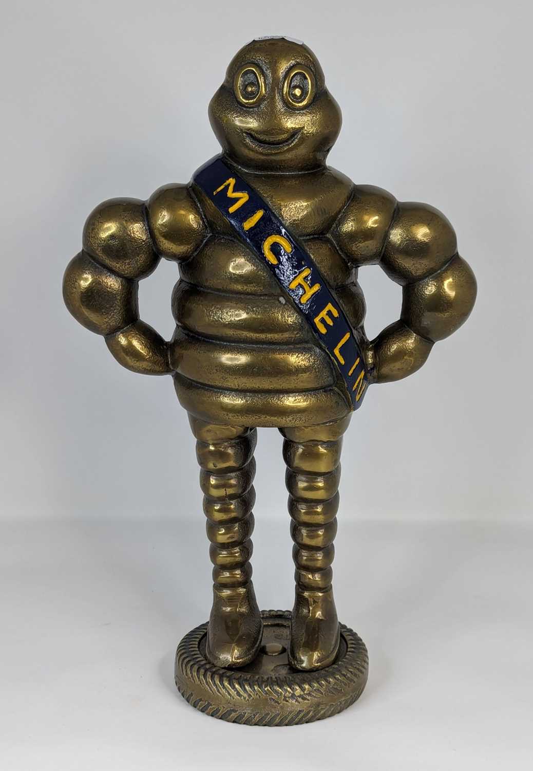 A reproduction brass figure of the Michelin man, height 37cm