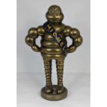 A reproduction brass figure of the Michelin man, height 37cm