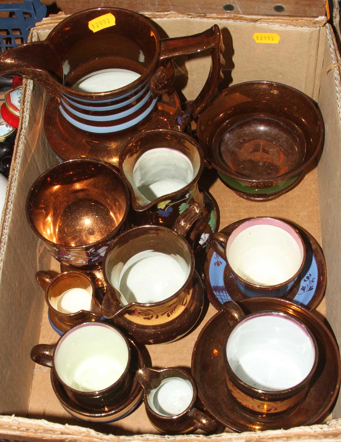 A collection of Victorian copper lustre ceramics to include jugs, and tea cups