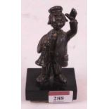 A Frank Meisler of Israel white metal figure of a musician, mounted upon a polished hardstone