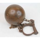 A reproduction metal ball and chain