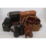 A collection of vintage cameras and binoculars to include examples by Silette and Kodak