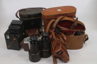 A collection of vintage cameras and binoculars to include examples by Silette and Kodak