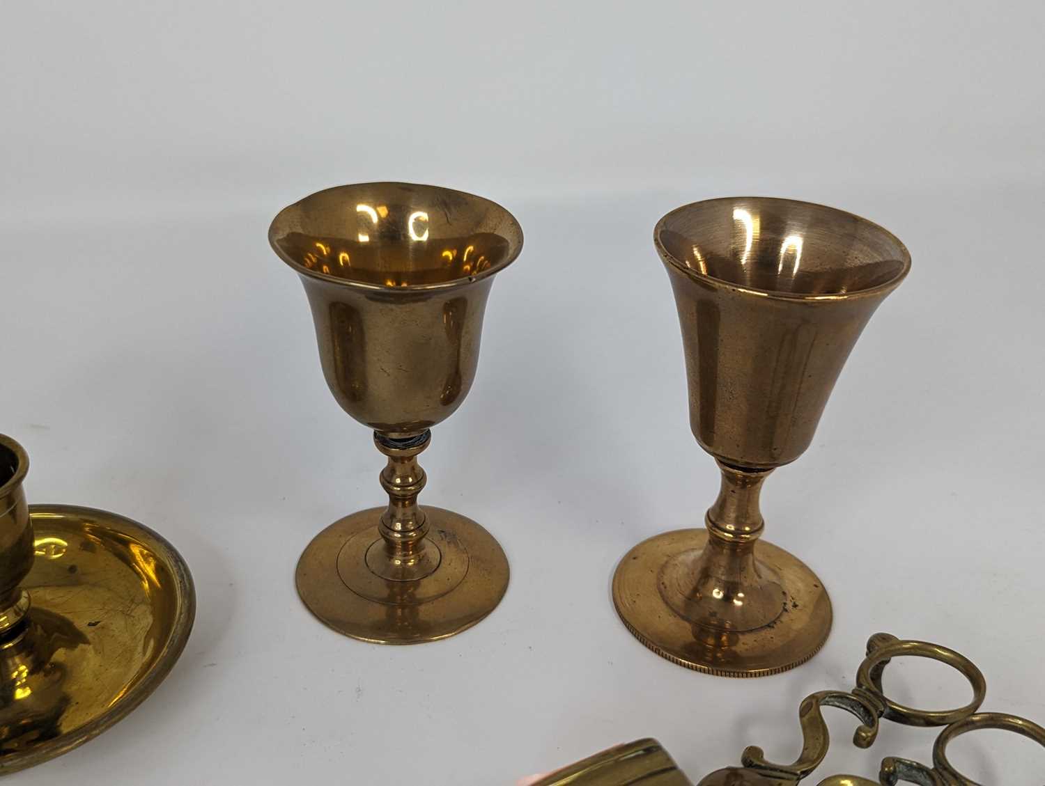 A collection of antique brass ware to include two travel communion cups, a Brighton bun pair of - Image 5 of 5