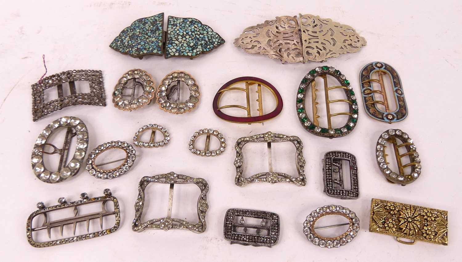A collection of 19th century and later paste set shoe buckles, together with enamelled metal belt