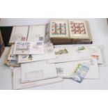 A collection of presentation packs of first day covers PHQ cards and stamps