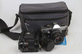 A Praktica NTL5 film camera; together with various lenses to include Carl Zeiss Jena DDR 74127,