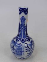 A Chinese blue and white glazed bottle vase, under glaze decorated with birds amongst flowers and