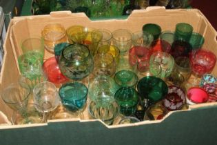A collection of 19th century and later coloured glassware to include wine hocks, trumpet shaped wine