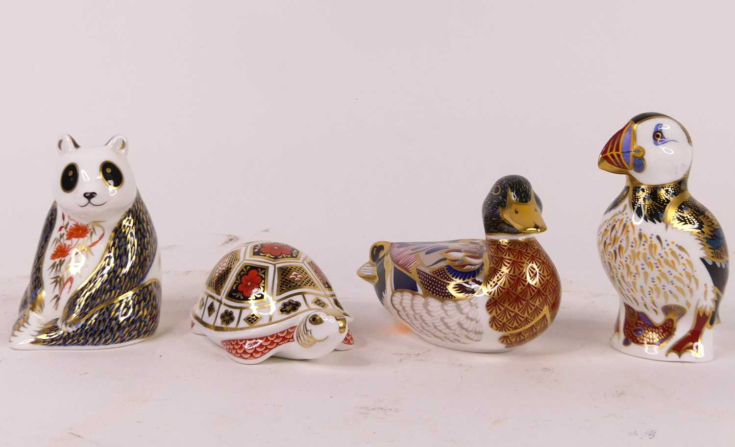 A collection of four Royal Crown Derby animal models, to include a mallard with gold stopper,