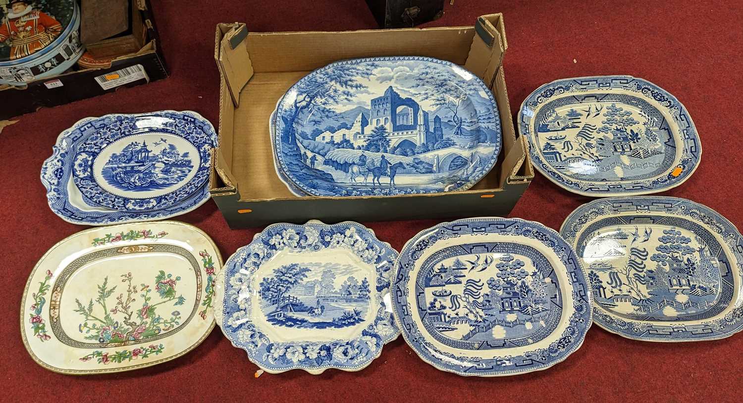 A collection of blue and white transfer decorated meat plates